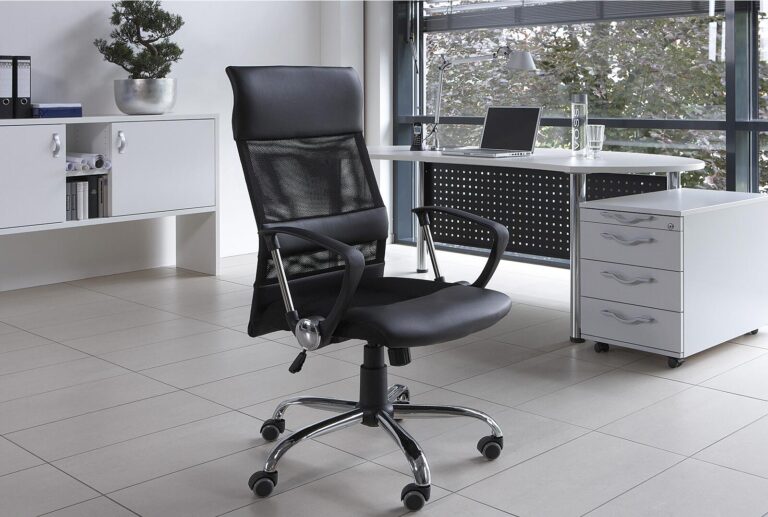 Black mesh office chair with adjustable arms and chrome base, in modern office setting.